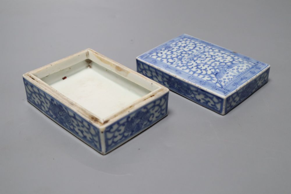 A pair of Chinese famille rose bowls and covers, late 19th century, a blue and white box and cover, 11cm and an eggshell bowl, 8cm